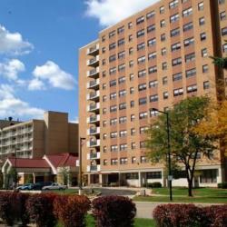 Large brown brick building complex for Akron Metro Housing
