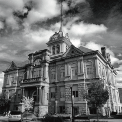 Carrolton Courthouse in black and white with cloudy sky above