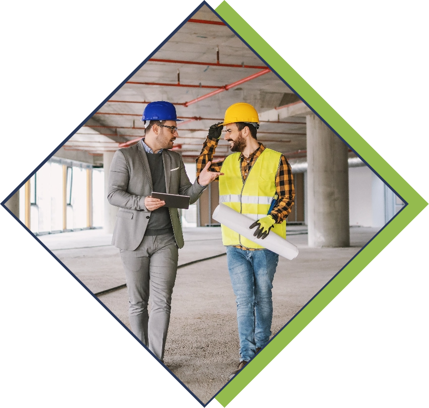 Construction worker and architect walking through project building