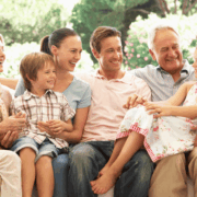 parents and grandparents admiring their grandchildren