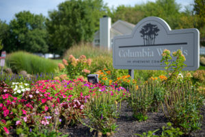 Commercial landscaping design in front of Columbia Woods Apartments with fresh flowers