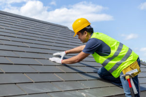 a man repairing roof