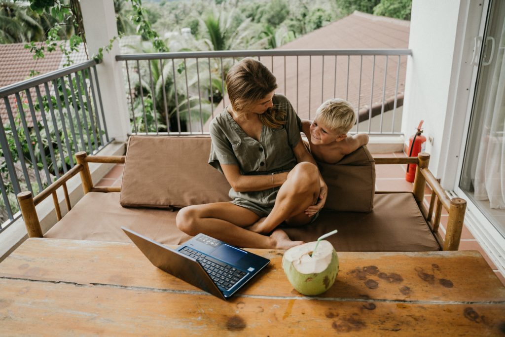 Lady working from home with her child