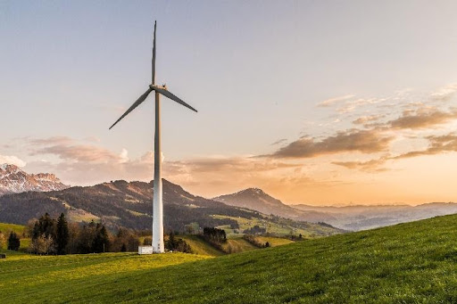 Windmill over grassy hills