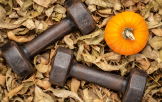 halloween workout dumbbells with a pumpkin