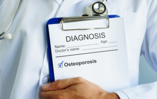 picture of doctor holding clipboard with osteoporosis written on it