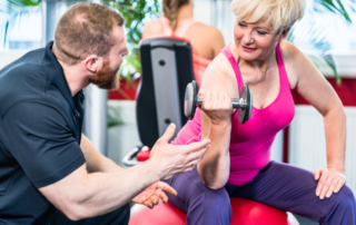 Woman working out with trainer