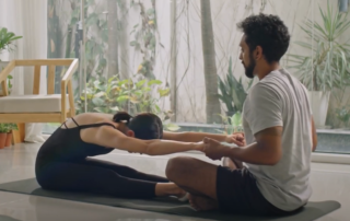 A man and woman stretching together