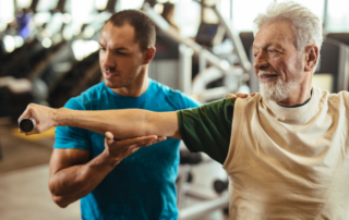 Man working out with personal trainer