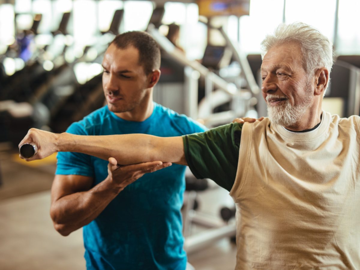 Man working out with personal trainer