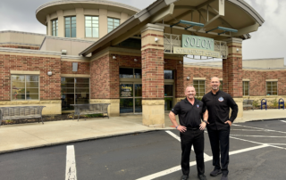 joe butler and stephan from prescription fitness standing in front of solon community center