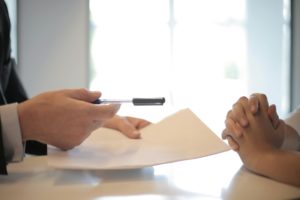 person signing paperwork