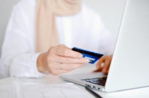 woman paying with credit card