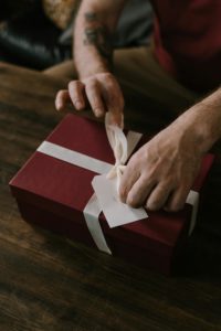 Person wrapping present
